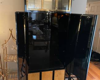 #5 living room Henredon circa 1990 lighted bar cabinet. Black lacquer, brass, mahognay burled wood, four doors, three drawers.(as is finish pictured) 82 x 19 x 27 $1,500.00