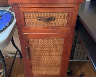 #36 Wood and Wicker side table with leather pulls - 1 door, 1 drawer. 34.5h x 16.5w x 14d $30.00