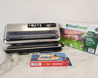 Lot 9082 Food Saver Vacuum Sealer  RollsBags  Wustof Knife Sharpener