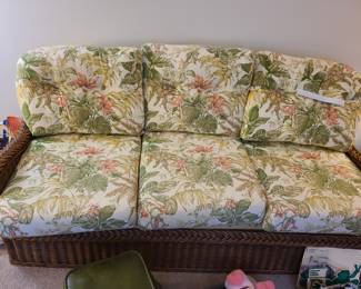 wicker sofa with floral pattern