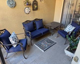 A Four-Piece Brown Jordan Cast Aluminum Patio Furniture Set