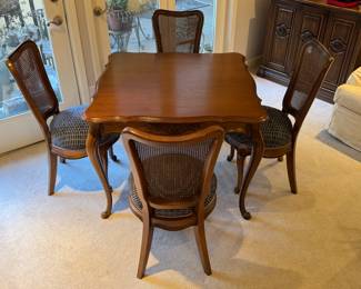A French Provincial Style Dining Set, comprising a Table and Four Chairs