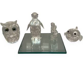 A Collection of Swarovski Crystal Animal Figurines, including a Large Penguin 7643 / 010008
