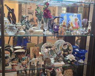 Curio full of eye-catching collectibles and decor