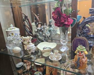 full curio cabinet of collectibles and fanciness