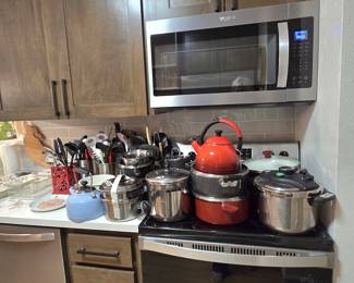 lots of pots, pans, cookware, utensils, etc