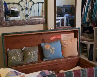 vintage trunk, pillows, linens, quilts