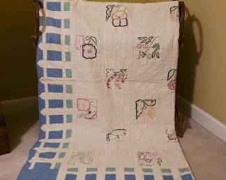 Hand-Embroidered Quilt With Floral Motifs