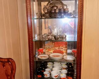 D. H. Holmes, and silver-plated items and cabinet