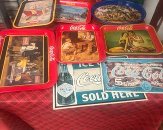 Coca Cola trays and metal signs 