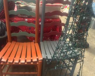 Wooden accent chairs and lighted Christmas decor 