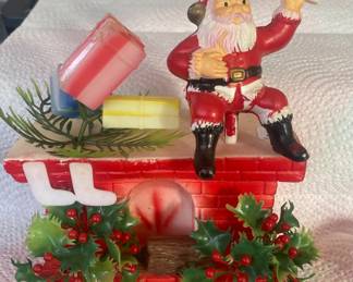 Old plastic Santa on fireplace