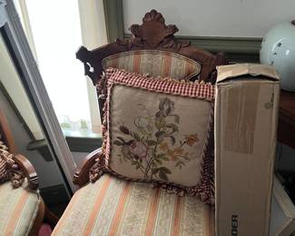 Lots of cute side chairs and needlepoint pillows. 