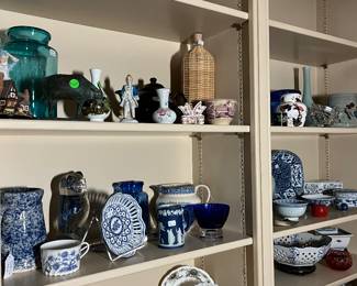 Den has many shelves of fine items. Lots of blue and white !