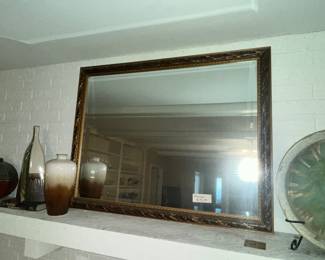 Large, beveled glass mirror w/ embossed frame