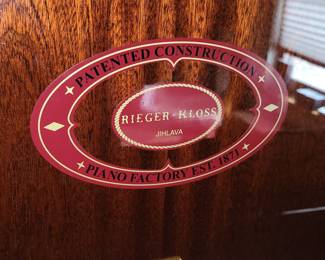 Rieger Kloss model 122 Demichippendale upright piano and adjustable bench