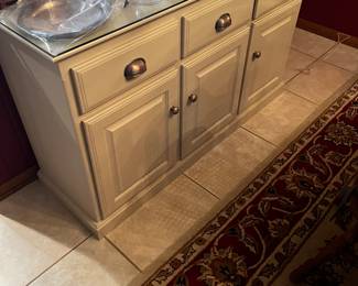 Kitchen buffet with glass top cover for protection 