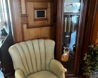 Green checked French provincial chair and grandfather clock Howard miller. Anniversary present from mobile oil.  