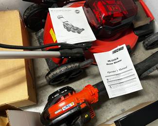Battery operated mower and leaf blower.  Seldon used.  Two batteries