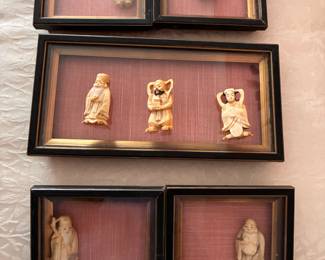 Bone carvings in shadow boxes