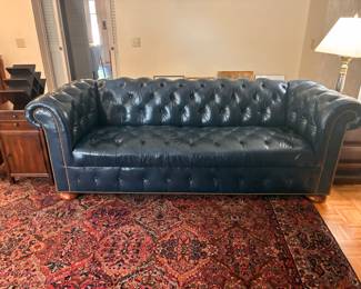 Leather couch and Karastan rug