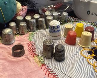 Thimble collection including plastic, ceramic, brass & sterling thimbles, 