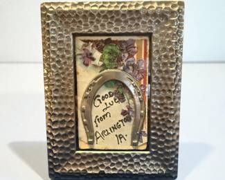 Framed vintage postcard with metal horseshoe