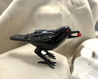 Glass Raven with red ball in beak