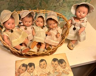 Did Dionne quintuplets dolls with original clothing and named pins. (there was no room for Yvonne in the basket)