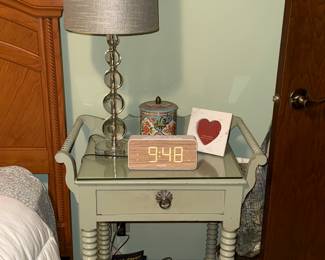 Nightstand, crystal lamp, books