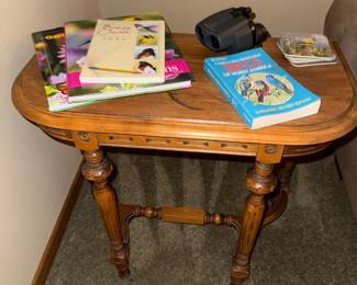 Side table, birding books, binoculars 