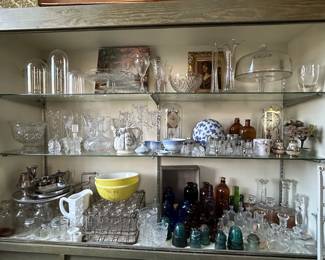 Clocks, milk bottles with caged carrier, amber bottles, insulators, milk glass