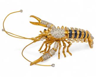 Lot 67
18K Gold Lobster Pin, 1.62cts Round Diamonds, 4.8cts Blue Sapphires H 2.7" W 3" 28 g