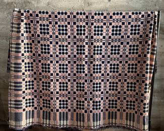 This lot features an incredible 19th century Welsh double-cloth "tapestry" blanket, with the iconic Caernarfon pattern. This design is one of the most recognizable traditional Welsh patterns, dating back to the early 19th century. This item can be used as a rug, blanket, hung as a work of art, or however you’d like to display and use it. Minor holes throughout, but in good overall condition for its age. This piece measures, 84” H x 74” W.
