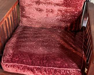 This lot features a stunning antique Morris chair with an adjustable back, removable cushions, and a spindle design on the sides with carved paw feet. This chair measures, 39” H x 31” W x 30.5” D.
