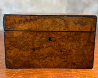 This lot features an antique English double tea caddy, likely Georgian and measures, 5.5” H x 9” W x 5” D. Tea caddies were popular in the 18th and 19th centuries when tea was a valuable commodity.
