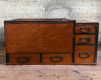 This lot features a Japanese hibachi cabinet with five (5) drawers, and a removable glass lid above the copper lined well. This cabinet measures, 14” H x 28” W x 15” D.
