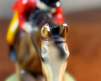 This lot features a sculpture of a jockey on a horse jumping over a fence, manufactured by ABCO, otherwise known as the Alexander Backer Company. In good overall condition with minor wear shown in photos, original ABCO sticker underneath, and measures, 9” H x 11” W x 3.5” D.
