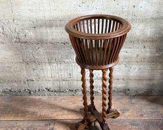 This lot features an antique solid wood barley twist fern stand in very good condition and measures, 32” H x 15.5” W x 15.5” D.

