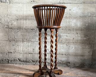 This lot features an antique solid wood barley twist fern stand in very good condition and measures, 32” H x 15.5” W x 15.5” D.

