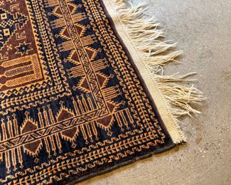 This lot features a Baluch prayer rug in very good condition. This rug was gifted by a Saudi Arabian official as a gesture of thanks for his time as Consul General during a social engagement. This Baluch rug measures, 78” H x 47” W. 
