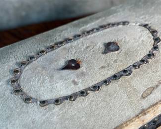 This lot features an antique trunk, most likely an immigrant trunk circa 1890s. The trunk is made of wood and animal hide with a lined paper interior. This trunk measures, 8” H x 21” W x 10.5” D.
