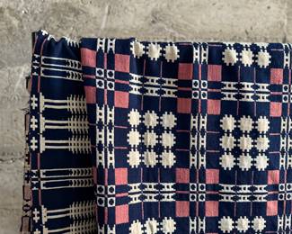 This lot features an incredible 19th century Welsh double-cloth "tapestry" blanket, with the iconic Caernarfon pattern. This design is one of the most recognizable traditional Welsh patterns, dating back to the early 19th century. This item can be used as a rug, blanket, hung as a work of art, or however you’d like to display and use it. Minor holes throughout, but in good overall condition for its age. This piece measures, 84” H x 74” W.
