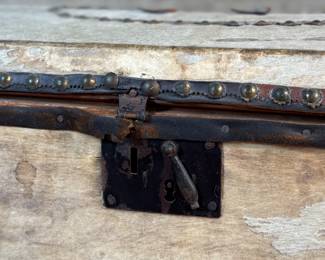 This lot features an antique trunk, most likely an immigrant trunk circa 1890s. The trunk is made of wood and animal hide with a lined paper interior. This trunk measures, 8” H x 21” W x 10.5” D.
