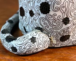 This lot features a stunning antique Chinese cloisonné sculpture of a Dalmatian dog. The tail is barely holding on as shown in photos, but is complete and a stunning sculpture. This Dalmatian measures, 14.5” H x 7” W x 9.5” D.
