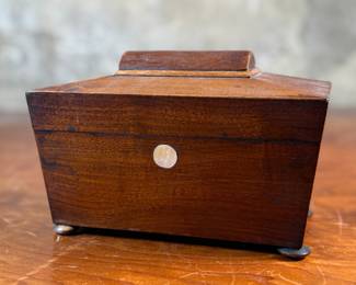 This lot features an antique English double tea caddy, likely Georgian and measures, 5.5” H x 8” H x 4.25” D. Tea caddies were popular in the 18th and 19th centuries when tea was a valuable commodity.
