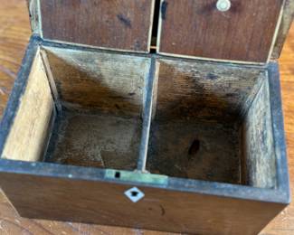 This lot features an antique English double tea caddy, likely Georgian and measures, 4.5” H x 7.25” W x 4.25” D. Tea caddies were popular in the 18th and 19th centuries when tea was a valuable commodity.
