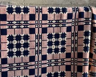 This lot features an incredible 19th century Welsh double-cloth "tapestry" blanket, with the iconic Caernarfon pattern. This design is one of the most recognizable traditional Welsh patterns, dating back to the early 19th century. This item can be used as a rug, blanket, hung as a work of art, or however you’d like to display and use it. Minor holes throughout, but in good overall condition for its age. This piece measures, 84” H x 74” W.
