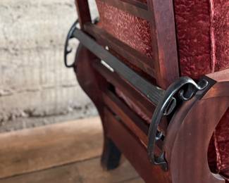 This lot features a stunning antique Morris chair with an adjustable back, removable cushions, and a spindle design on the sides with carved paw feet. This chair measures, 39” H x 31” W x 30.5” D.
