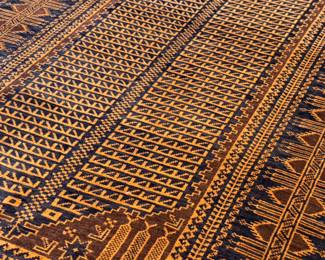 This lot features a Baluch prayer rug in very good condition. This rug was gifted by a Saudi Arabian official as a gesture of thanks for his time as Consul General during a social engagement. This Baluch rug measures, 78” H x 47” W. 
